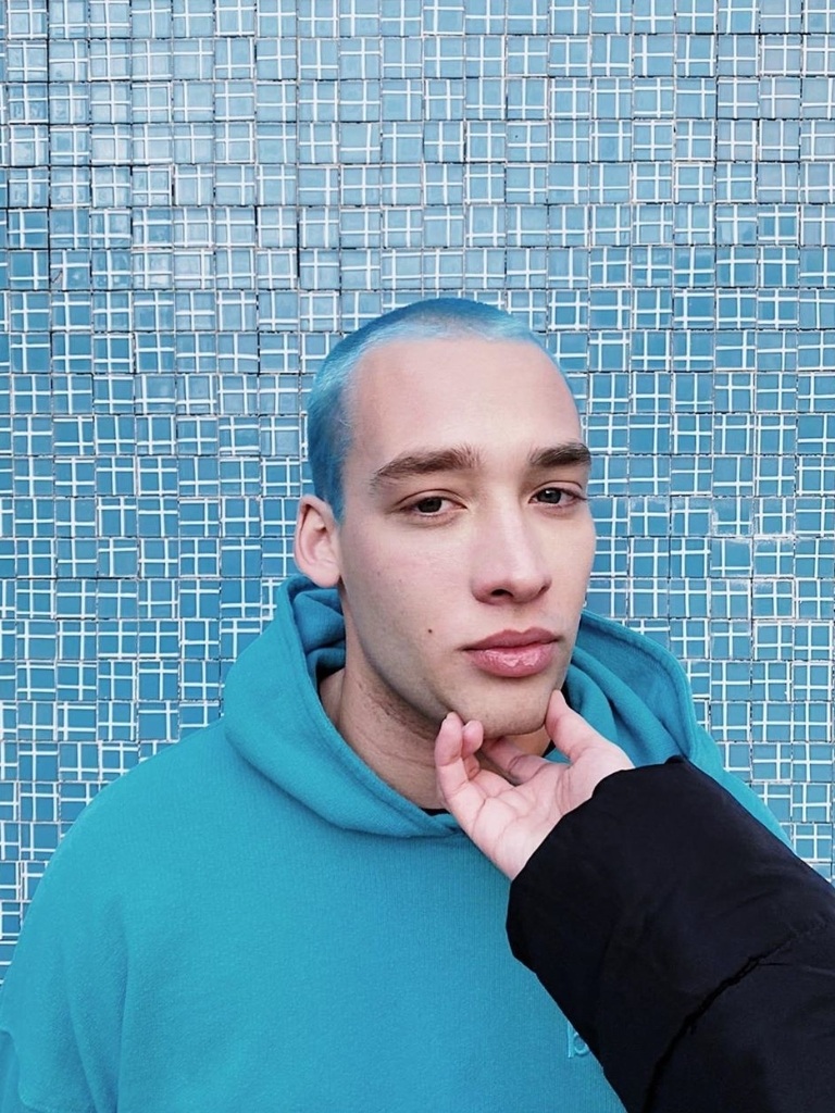 Man with a blue buzz cut