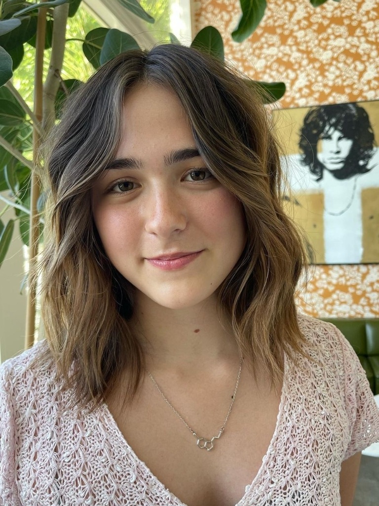 Woman with choppy layers on highlighted hair