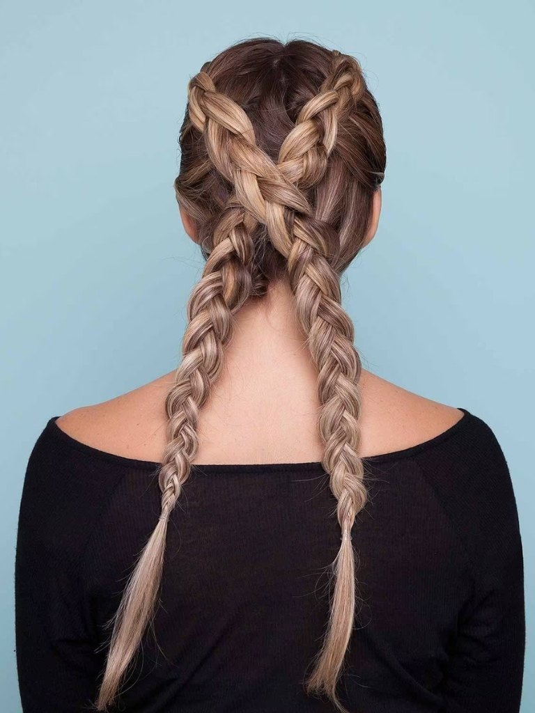 Person with blonde criss cross braids