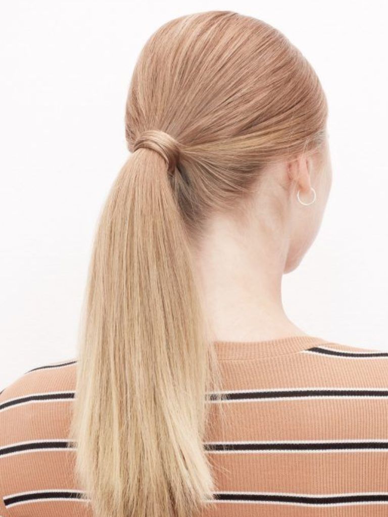Woman with classic low ponytail hairstyle