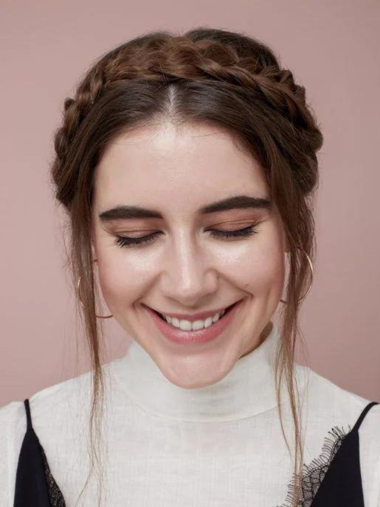 Woman with dark brown milkmaid braid