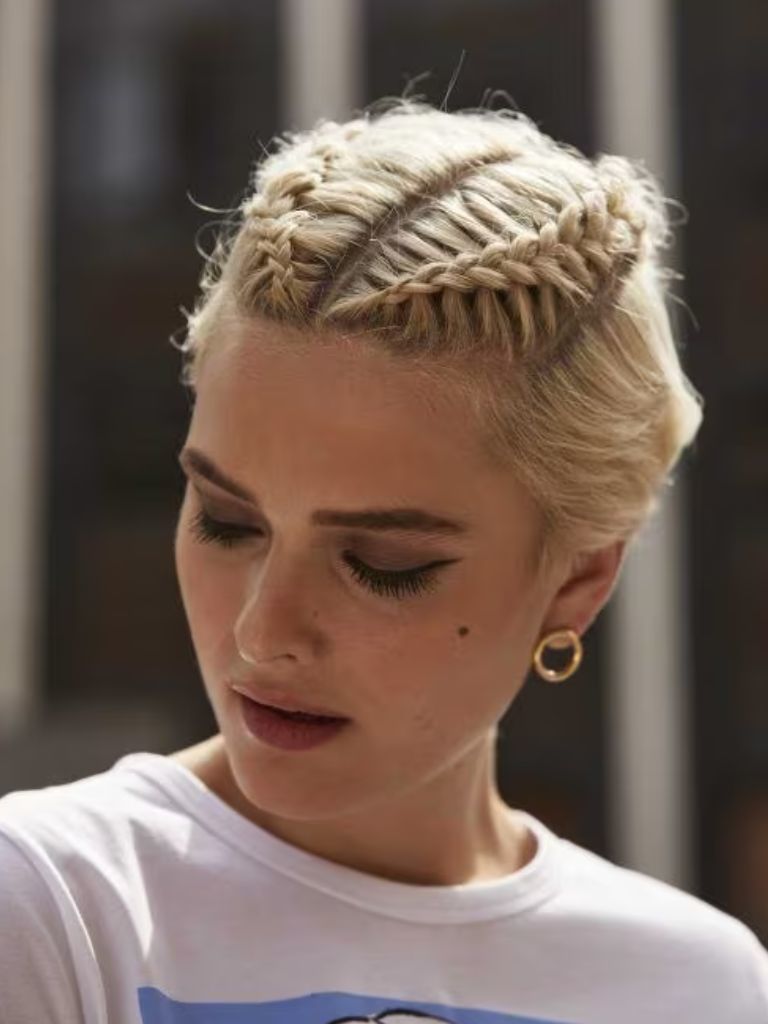 Woman with short blonde hair with mini braids