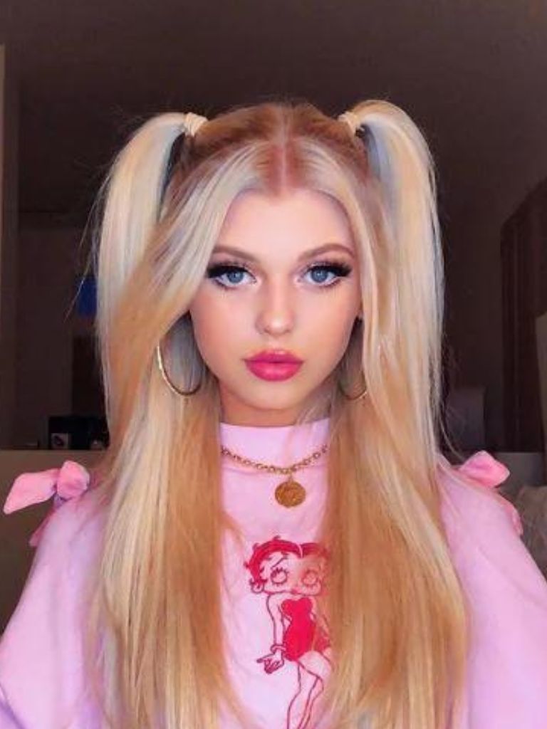 Long blonde hair in pigtails half-up, half-down