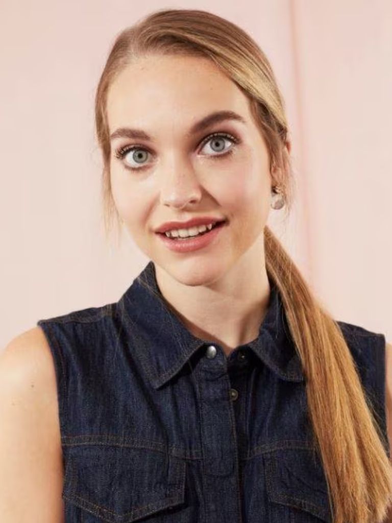 Side parted blonde hair in a ponytail