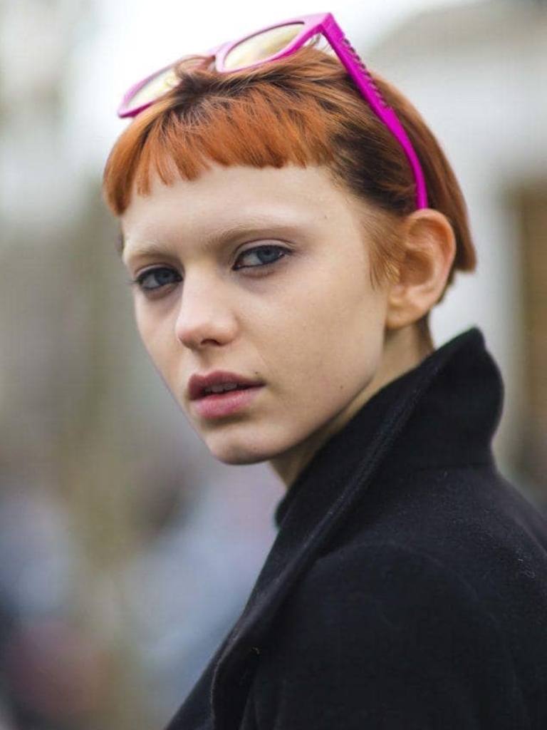 Woman with micro fringe orange bob