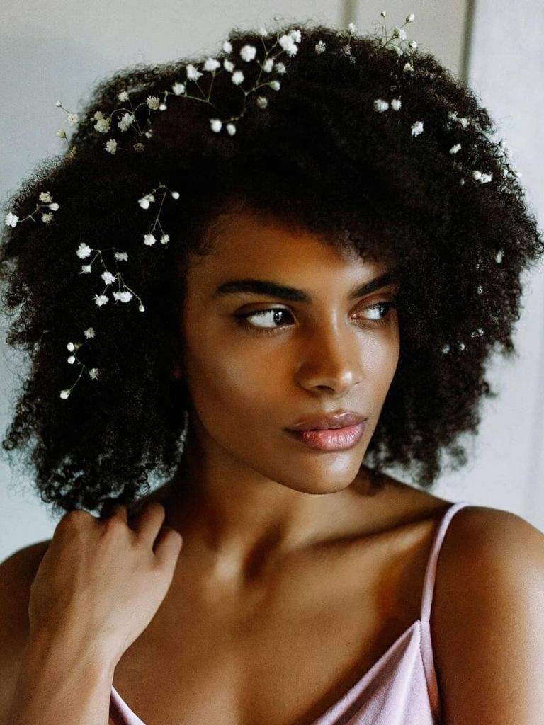 Afro bridal hairstyle with flowers