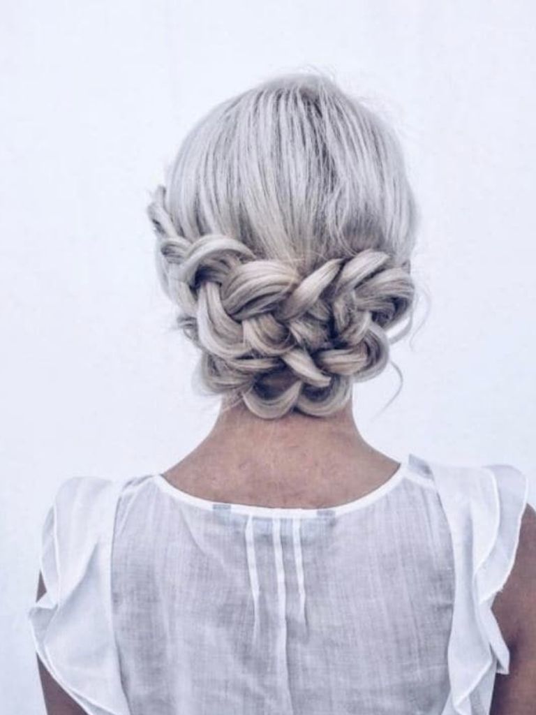 Low braided wrap hairstyle wedding bridal
