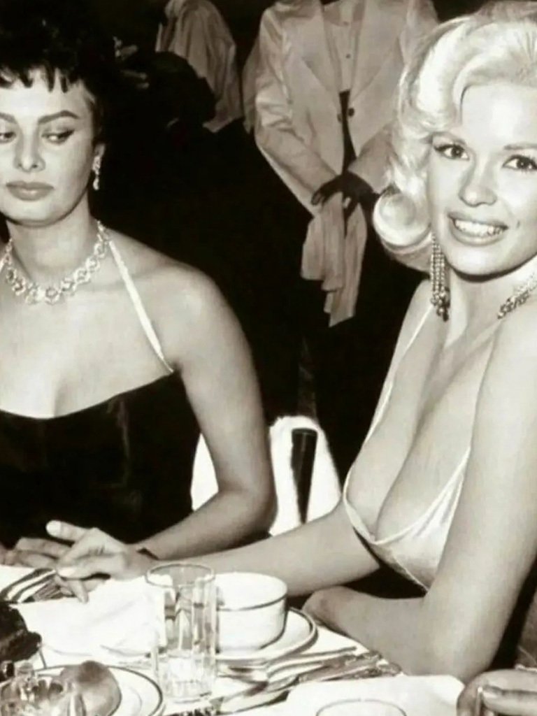 Jayne Mansfield and Sofia Loren. Sofia looks askance as Jayne's cleavage