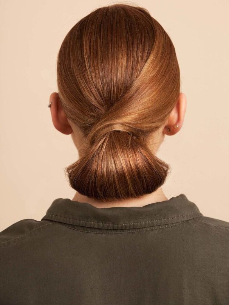 Redhead with a wrapped chignon hairstyle