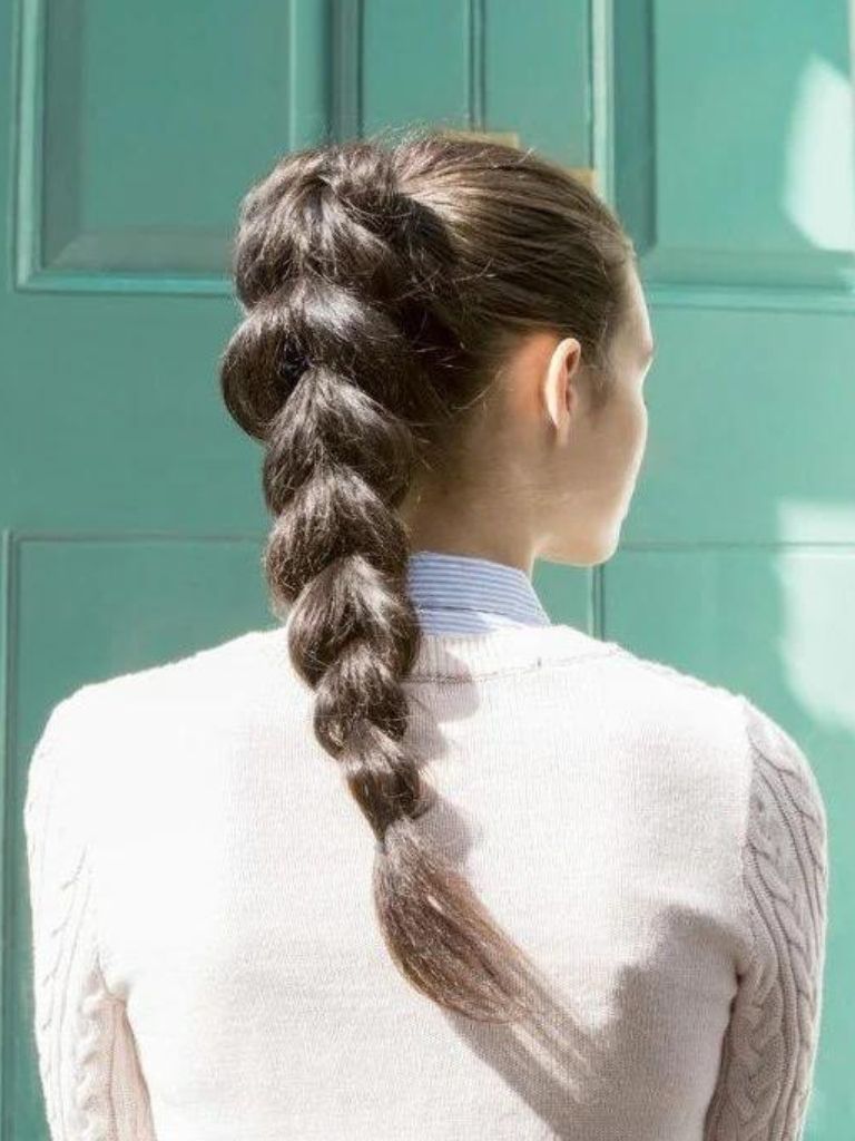 Woman wearing a thick braid