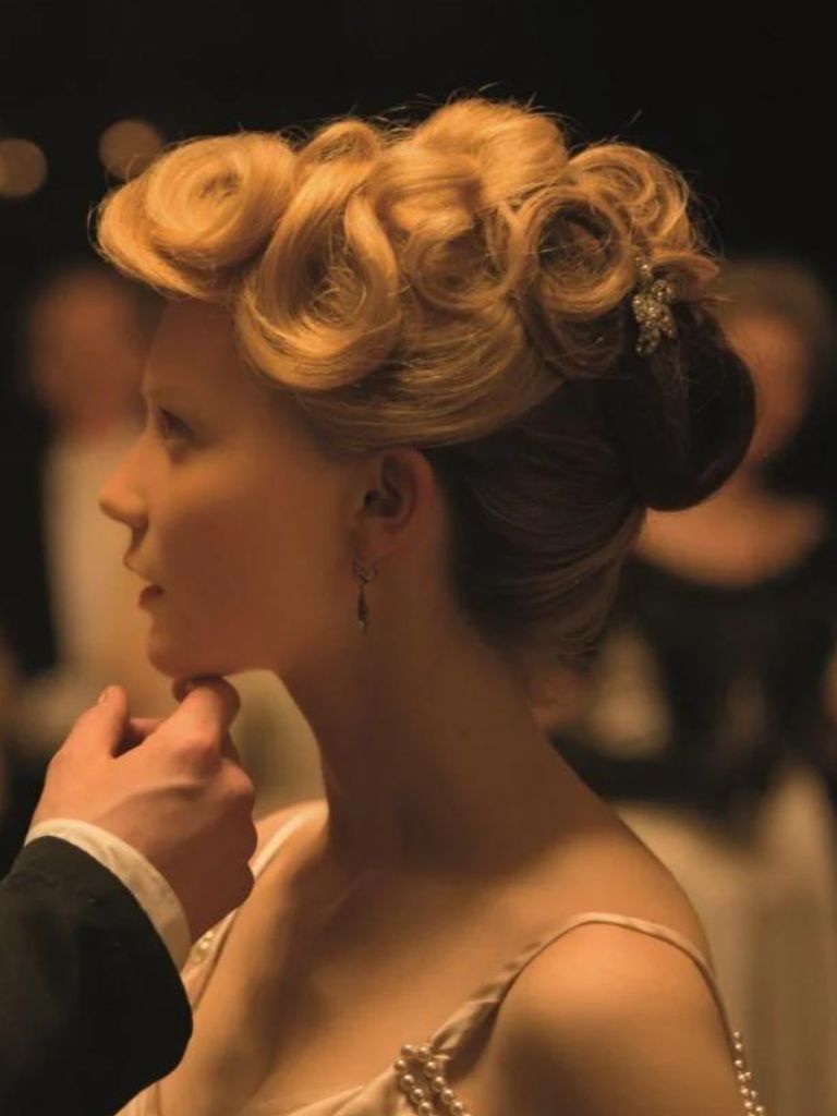 Victorian hairstyles: Close-up of Mia Wasikowska in Crimson Peak with blonde pin curled updo hair