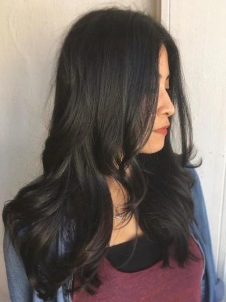 Club hairstyles: Asian woman with long dark blowout hair