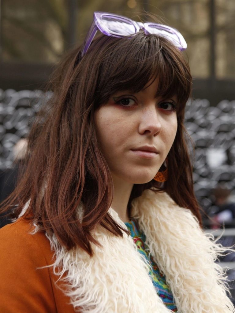 Brunette woman with a full fringe