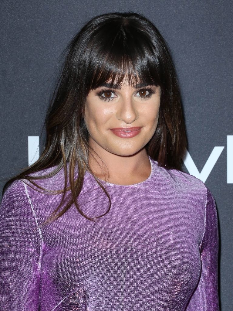 Lea Michele with full fringe wearing purple glittery dress