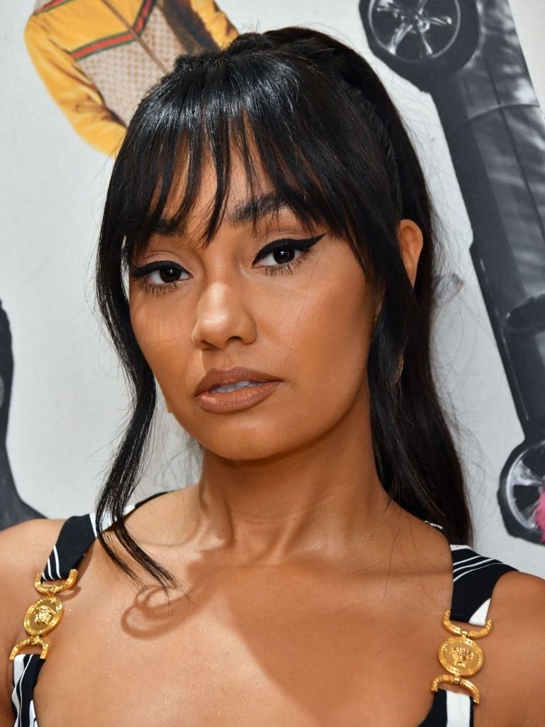 Little Mix star Leigh Anne Pinnock with dark brown hair in a ponytail with long bangs