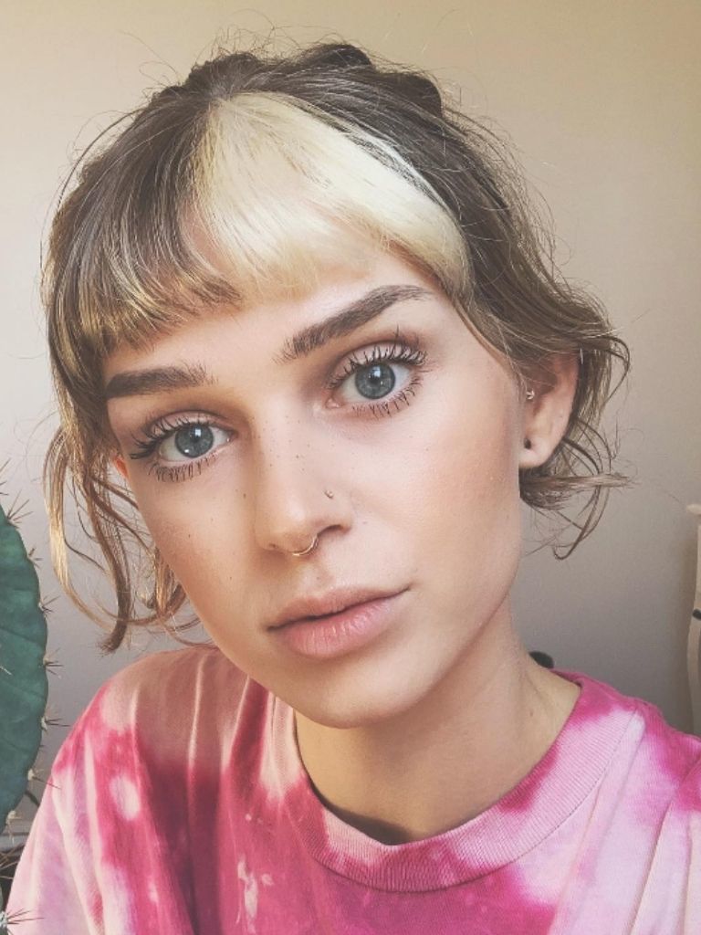 Woman with dyed blonde and brown hair fringe