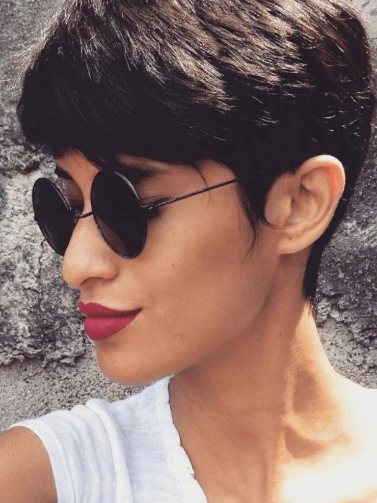 Woman with brown straight hair pixie cut