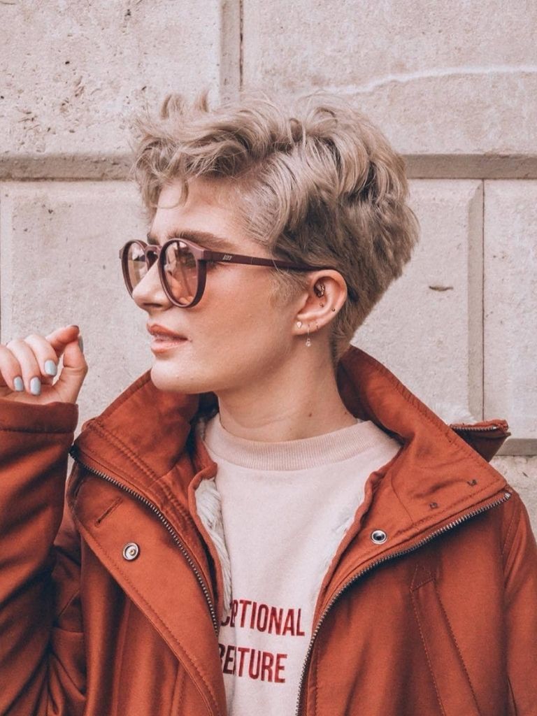 woman with ash blonde pixie haircut