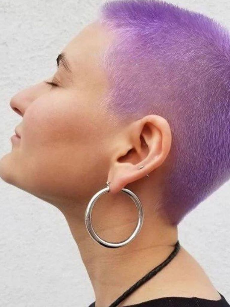 woman with a purple buzz cut pixie hairstyle