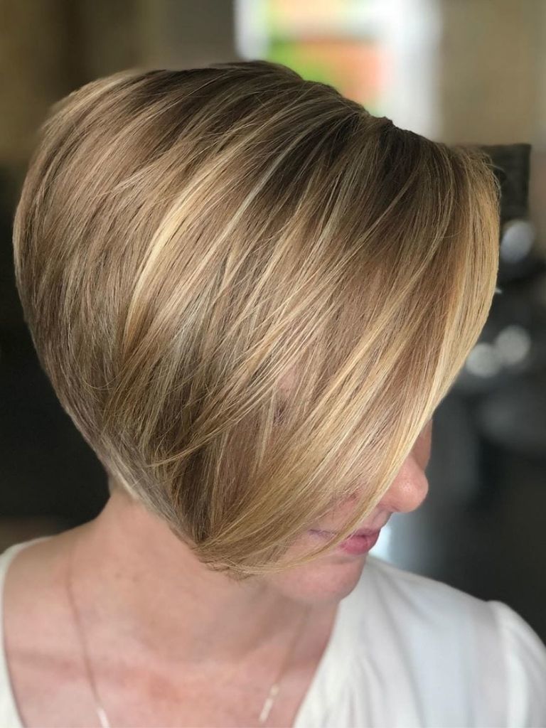 woman with dark blonde pixie haircut