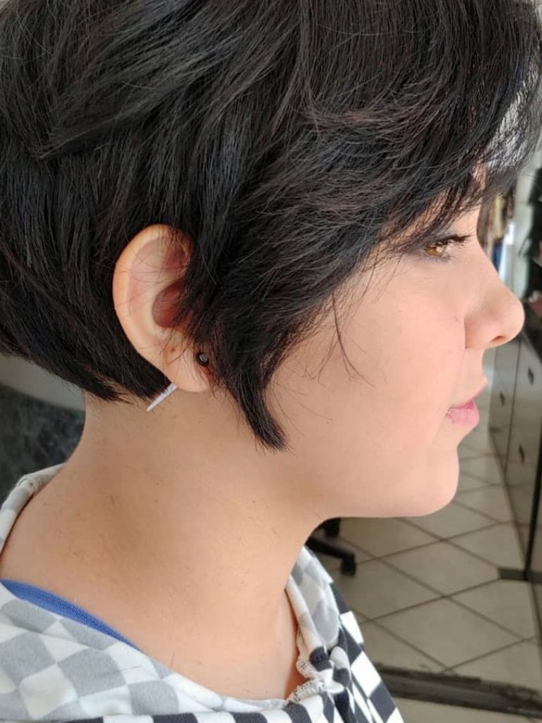woman with layered dark brown pixie haircut