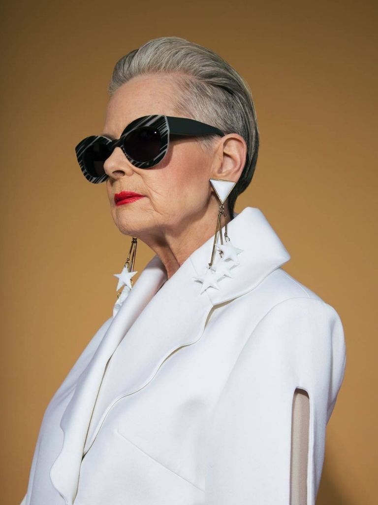 older woman with swept back hairstyle