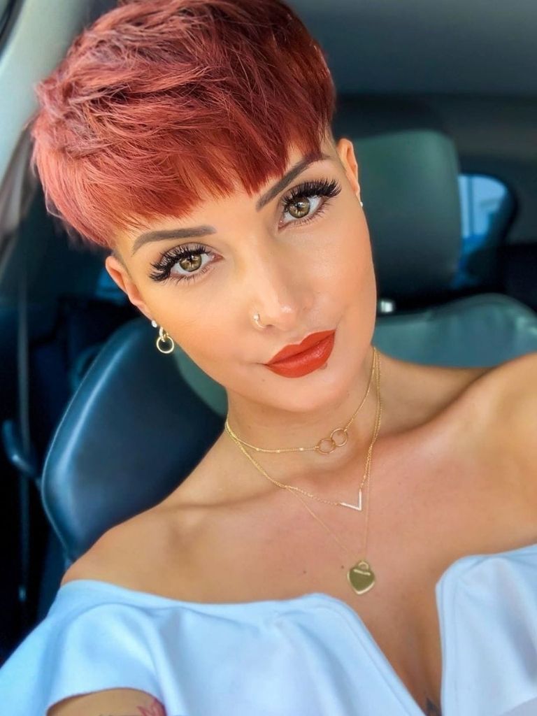 woman with red bowl cut pixie cut