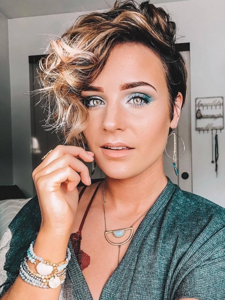 woman with dark brown to blonde pixie cut with bangs