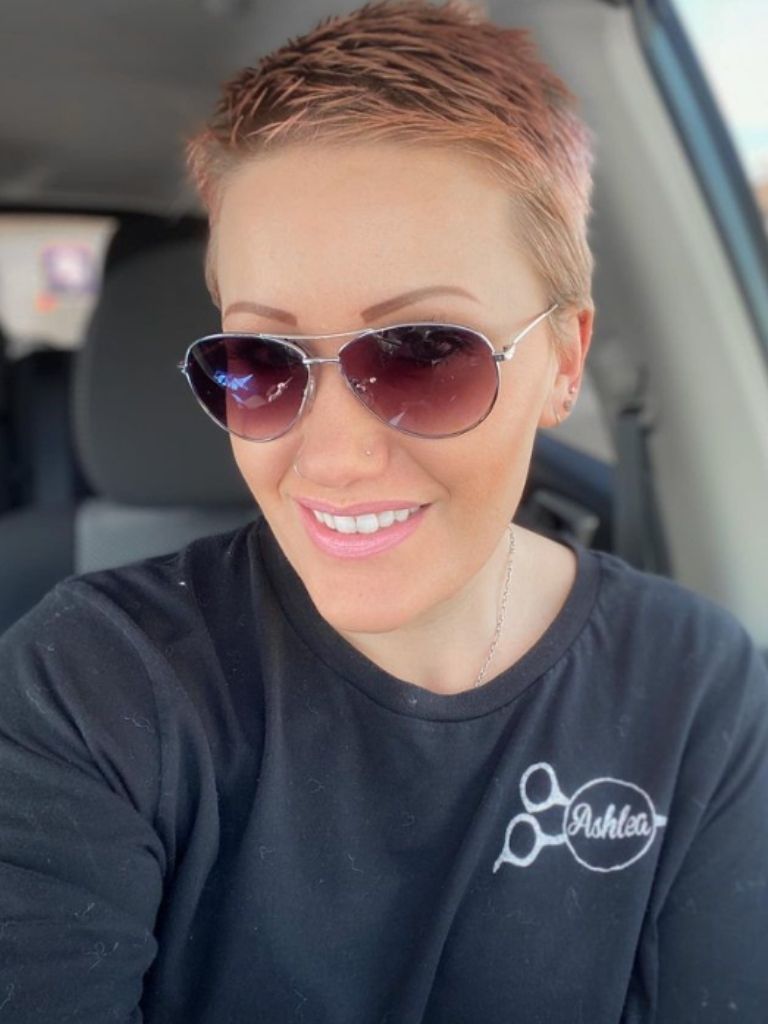 Woman with pink pixie haircut