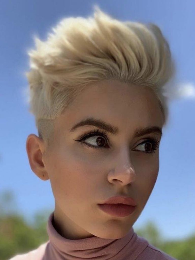 Woman with oval face and pixie haircut