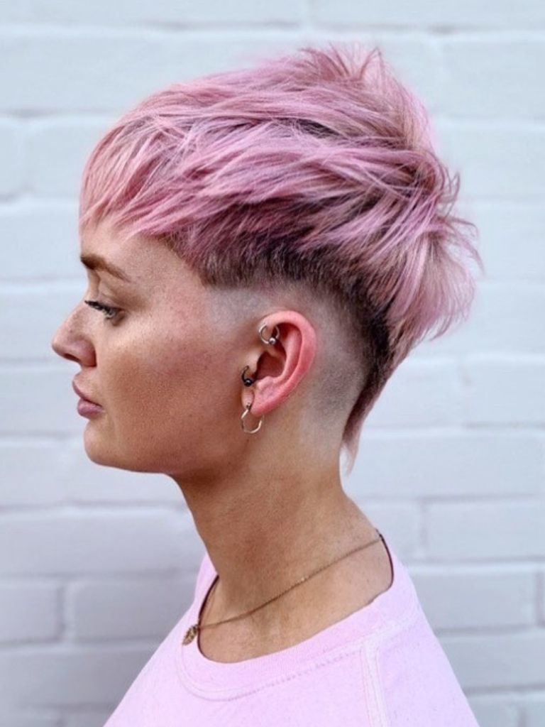 Woman with pink mohawk.