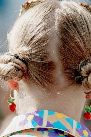 woman wearing space buns