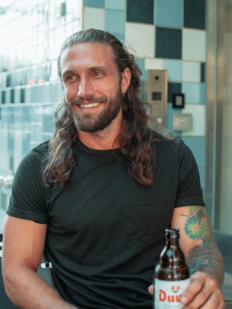Man with half up half down hair