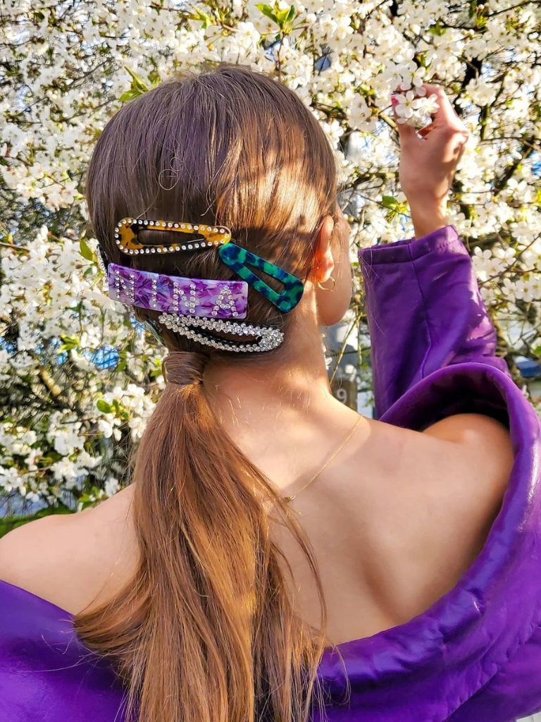 Woman with brown ponytail with cute clip accessories.