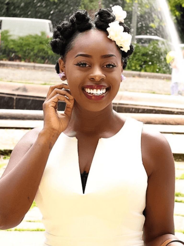 Woman wearing formal Bantu knot hairstyle.