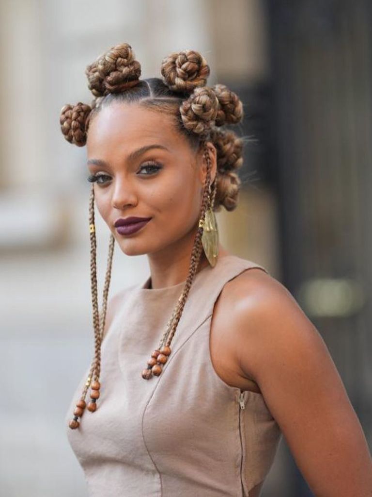 Woman with blonde Bantu knot hairstyle.