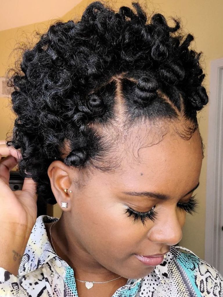 Woman with a mix of Bantu knots and natural hair.