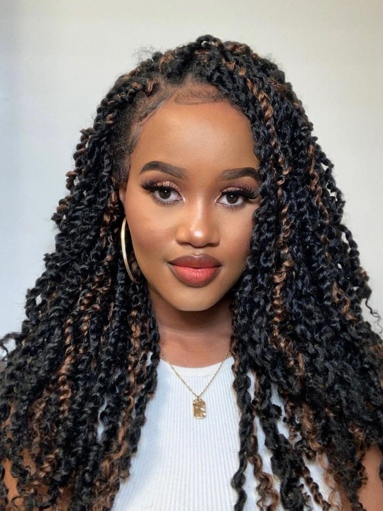 Woman with side swept Marley twists.