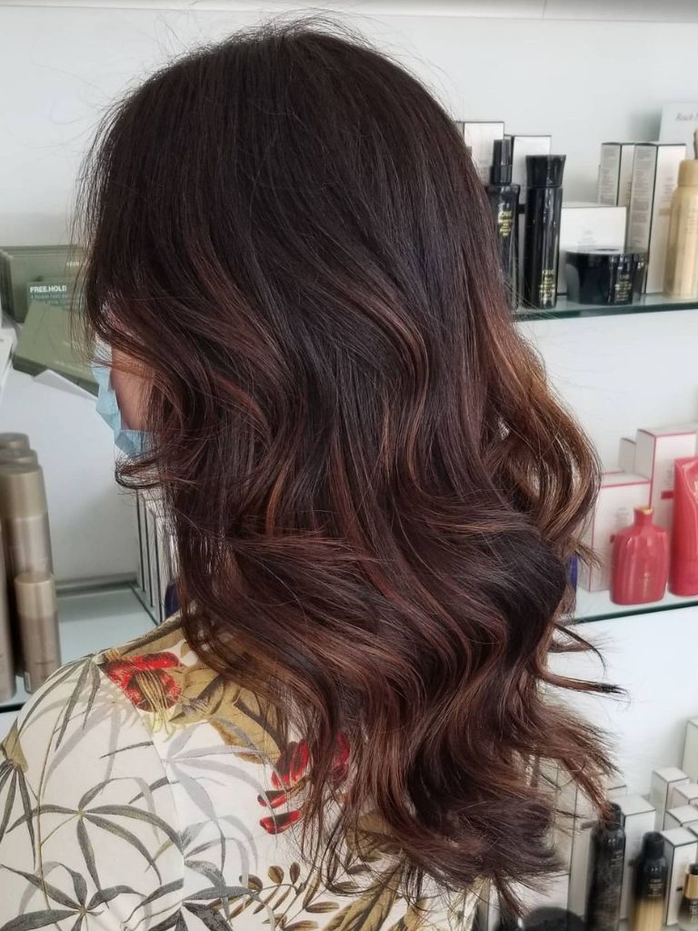 Woman with copper caramel hair.
