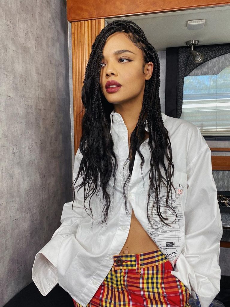 Woman with braids with wavy ends.