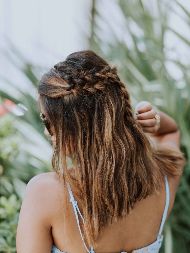 Woman with side half-up braid hairstyle