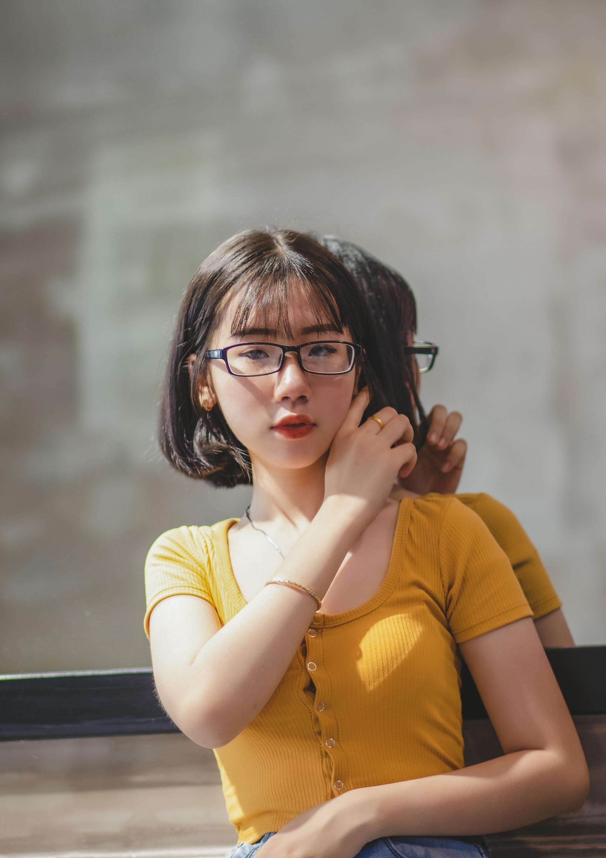 Asian woman with short hair wearing eyeglasses