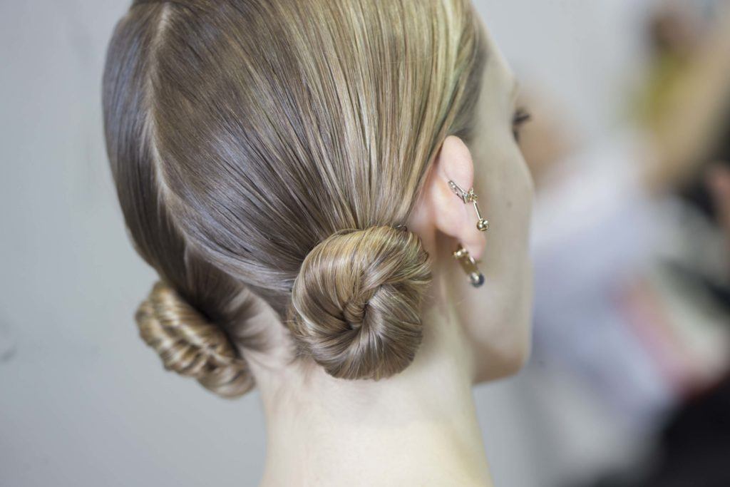model wearing double bun hairstyle
