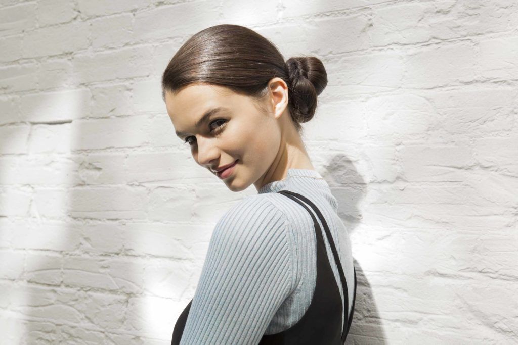 girl with pretzel side bun hairstyle