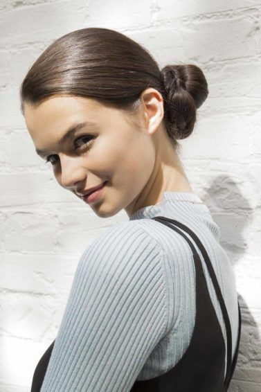 girl with one of bun hairstyles called pretzel side bun