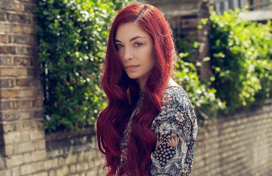 woman with long red hair burgundy hair color