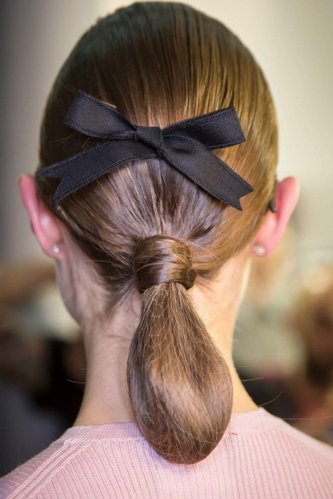 everyday hairstyles for work rolled up ponytail