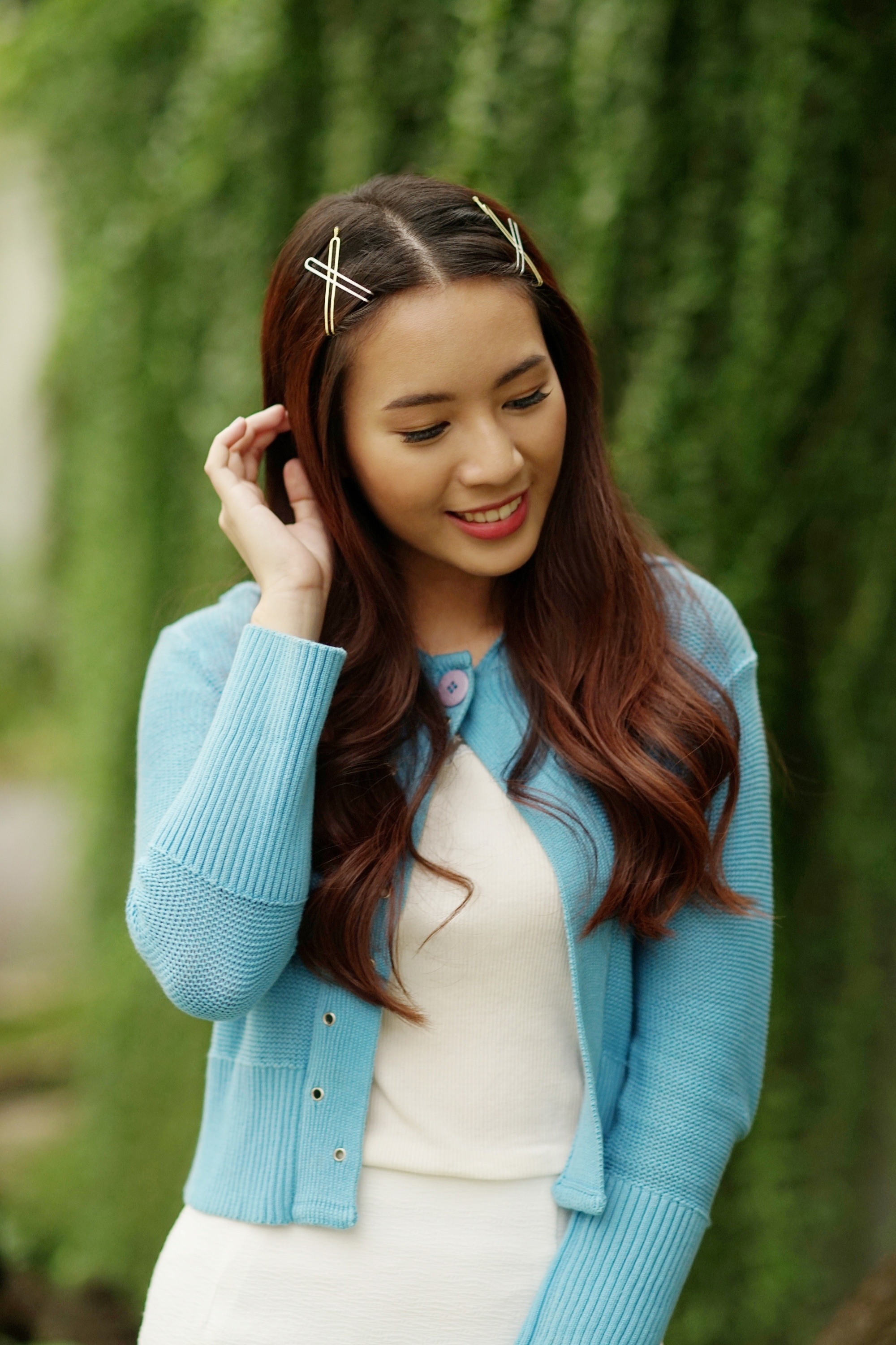 Asian woman with long hair wearing hair clips