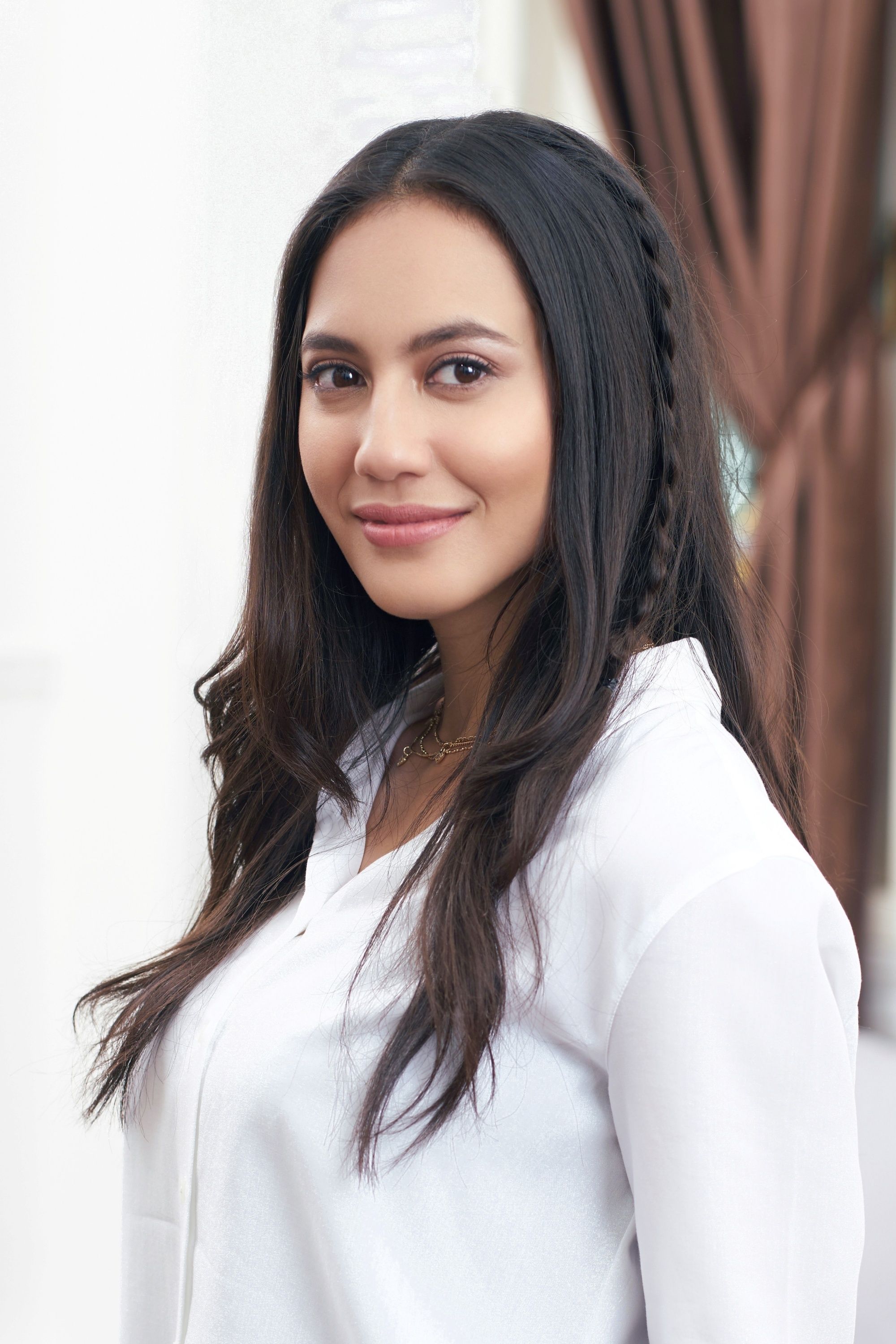 Asian woman with an accent braid hairstyle for long hair