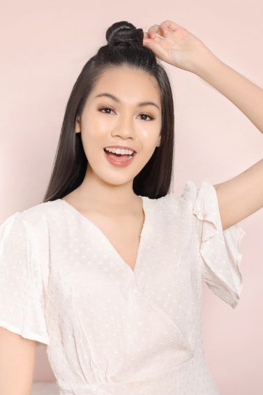 Asian woman with a half up top know hairstyle for long hair